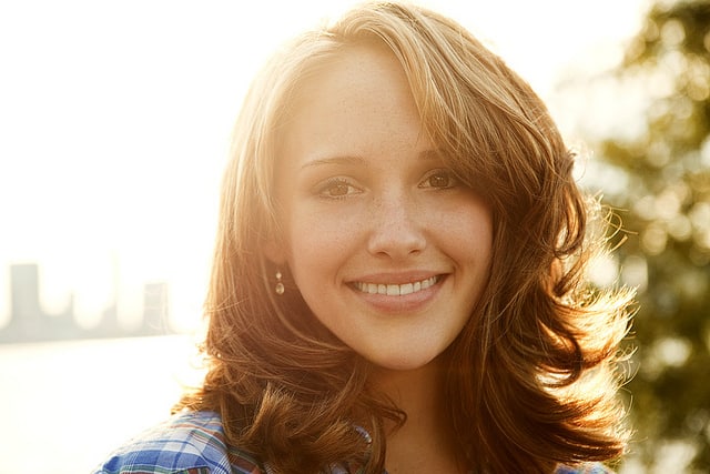 Backlit portrait of woman smiling